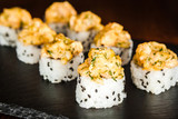 Fototapeta Maki - dishes of Japanese cuisine rolls with fish