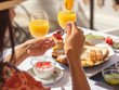 © Philippe Degroote/ADDICTIVE STOCK - Close up of woman having breakfast