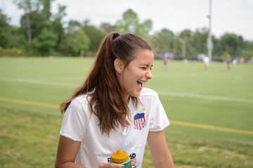 Female soccer playing laughing