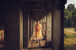 © lizavetta - Tourist woman in the temple of Angkor Wat.