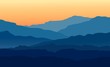 Vector landscape with blue silhouettes of mountains and hills with beautiful orange evening sky. Huge mountain range silhouettes in twilight. Vector hand drawn illustration.