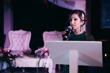 Beautiful Indian woman sings for her man in the restaurant