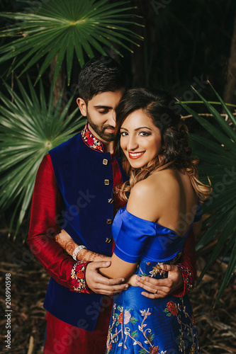 blue sherwani with red lehenga
