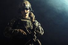 Special Forces Soldier With Rifle On Dark Background
