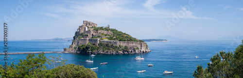Fotografía Ancient castle on the island in the blue sea panorama Ischia