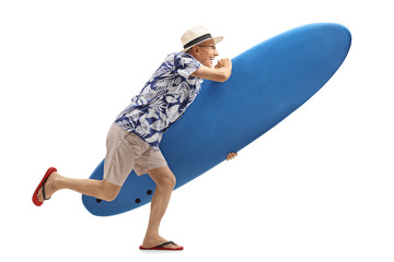 Canvas Print - Elderly tourist with a surfboard running