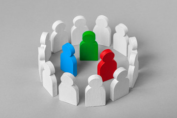 Wall Mural - Concept leader of a business team. Crowd of white men stands in  circle and listens to the leader of blue and red and green, work with objections, conflict