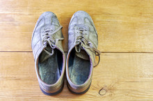 Vintage Dirty Low Shoes On A Wooden Background