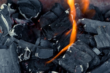 burning natural coals in a fire close up