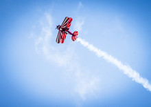 Red Plane With Propeller Flying Upward