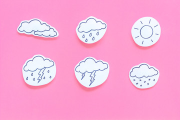 Wall Mural - modern weather icons set on pink background top view