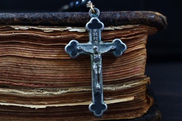 Wall Mural - Rosary and the Bible on a dark background