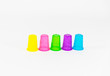 © Zhi - colorful plastic cups of lemonade on a white background. utensils for a picnic and travel