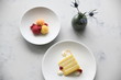 © Anna Petrow - Sorbet with raspberries and yellow sponge cake slice on plates