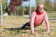 © 2Design - Senior man stretching after jogging in the park