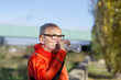 © 2Design - Handsome senior jogging man drinking fresh water from bottle after morning run