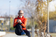 © 2Design - Senior runner man sitting after jogging