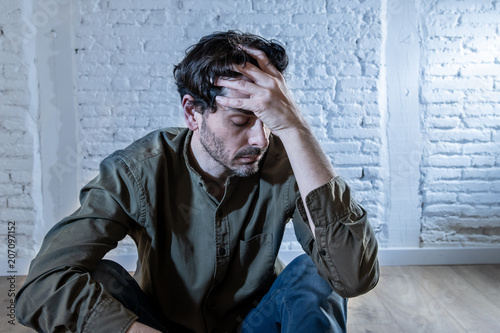 Fotografía sad depressed man leaning against a wall in mental health concept