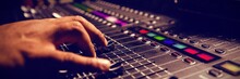 Cropped Hand Of Musician Using Sound Mixer