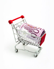 Sticker - Metal basket with an Euro 500 banknote in it. Consumption, shopping concept, pushcart.