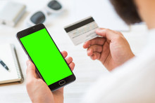Online Payments Plastic Card A Black Smartphone With Green Screen For Chroma Key Compositing