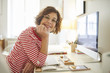 © Westend61 - Portrait of mature woman at desk at home