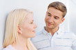 © contrastwerkstatt - Quizzical young man looking at his girlfriend