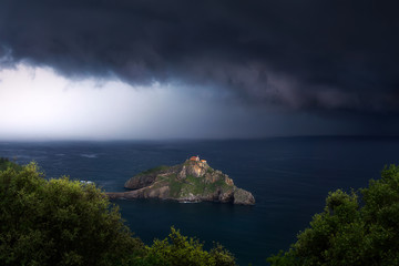 Poster - San juan de gaztelugatxe with stormy clouds