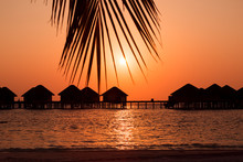 Silhouette Of Wooden Bungalows On A Pier At Sunset, Maldives