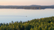 Lonely boater on a lake Lievestuoreenjärvi at sunset. Finland, Laukaa, view from Hyyppäänvuori.