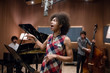 © Alvaro Hernandez/ADDICTIVE STOCK - Woman singing on band rehearsal
