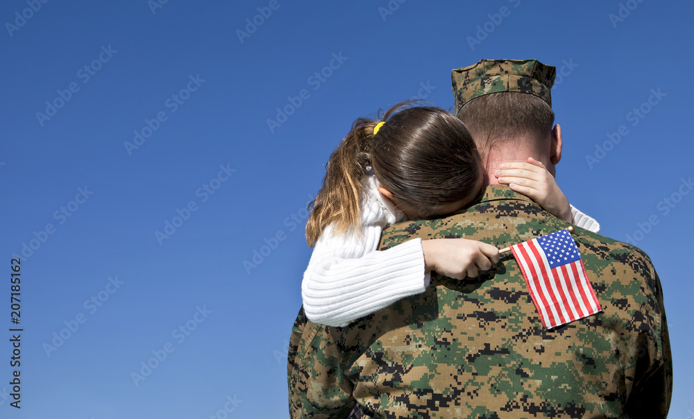Military Father Hugging His Daughter With An American Flag - obrazy, fototapety, plakaty 