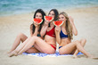 © olenachukhil - Group of young attractive girls having fun on the beach