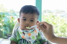 Cute Asian Baby Bored With Food