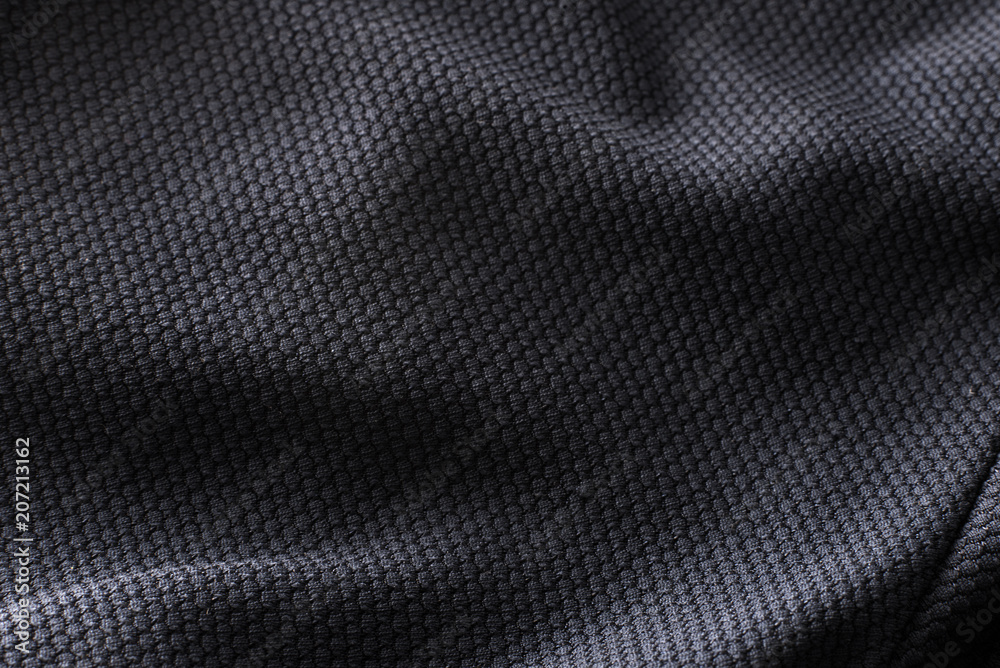 Close-up polyester fabric texture of black athletic shirt - obrazy, fototapety, plakaty 