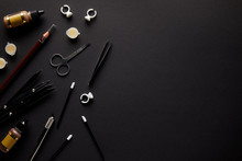 Elevated View Of Scissors, Pencil And Brushes For Permanent Makeup Isolated On Black