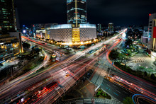 Night Scene Of Light Trails Traffic Speeds Through An Intersection In Jamsil Business District Of Seoul At Seoul City, South Korea.
