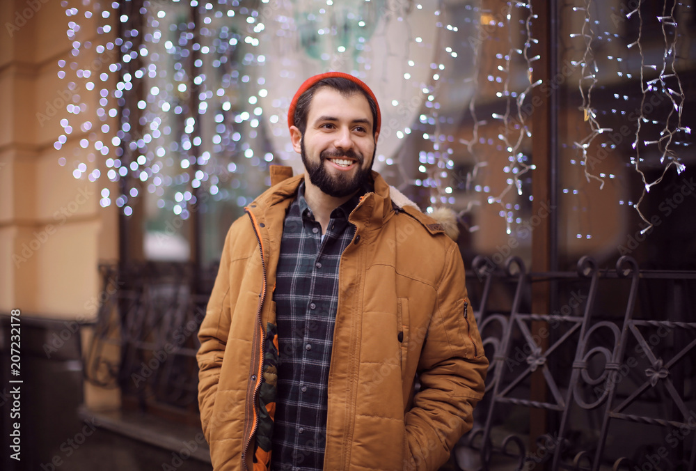 Handsome trendy hipster walking outdoors
