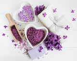 Fototapeta Lawenda - Spa towel and massage products with lilac flowers