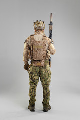 Wall Mural - Special forces soldier with rifle on white background.