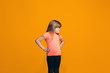 © master1305 - Portrait of angry teen girl on a orange studio background