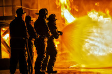 JOHANNESBURG, SOUTH AFRICA - MAY, 2018 Firefighters Spraying Down Fire During Firefighting Training Exercise