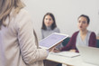 © LStockStudio - Businesswoman Presenting in Front of Audience