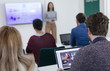 © LStockStudio - Businesswoman Presenting in Front of Audience