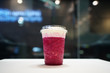 © Thaweerat - Plastic glass of pink dragon fruit smoothie with layer of cream cheese foam on blurred background, Traditional Taiwanese and Chinese Beverage.