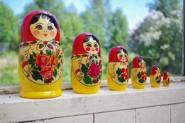 Matryoshka near a window on a terrace