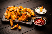 Baked Potato Fries On Wooden Table