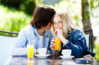 © Alvin Harambašić - Young romantic couple spending time together - sitting in cafe's garden