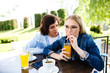 © Alvin Harambašić - Young romantic couple spending time together - sitting in cafe's garden, drinking juice and having fun