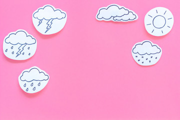 Wall Mural - weather forecast concept. modern weather icons set on pink background top view copy space